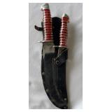 Double knives in leather sheath