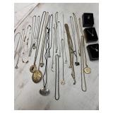 Large lot of chain necklaces, many with pendants,