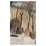 Three shovels and thatching rake