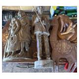 Large wood carved sculptures including lama,