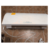 Silhouette CAMEO 3 Wireless Cutting Machine, designed for DIY projects like cutting vinyl, paper, and fabric.     Cutting Width: Up to 12 inches.