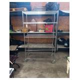 5 Shelf Metal Rack On Lockable Wheels.  77 Inches H By 48 Inches W By 24 Inches Deep