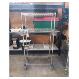 Metal Shelf Unit On Wheels With Removable Side Baskets And 2 Small Shelfs. 69 Inches H By 46 1/2 Inches W With Baskets 35 3/4 Inches W Without Baskets By 18 Inches Deep