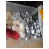 Box of tealight candles, small jar candles and green metal shelf