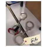 2 Pairs Of Handcuffs