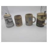 4 German Beer Stein’s Different Styles Approximately 7”H.