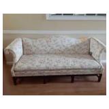 6ft White couch singular cushion floral design 6 wooden stands 6ft White couch singular cushion floral design 6 wooden stands