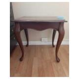 Small 8x11 square wooden table with French legs. 2 sides have pull out attachment