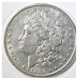 1886-O MORGAN DOLLAR AU/BU MARK ON CHEEK