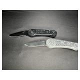 2  Folding Knives - 1 Black & 1 Silver