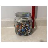 Glass Jar of Marbles (half full)