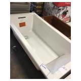 White drop in bathtub sold as is, damaged