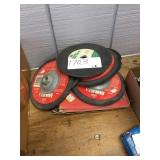 pile of abrasive blades and grinding wheels