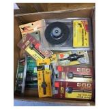 box of hole saw arbors and backing pads