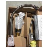 Single handle kitchen faucet w/ handheld sprayer.