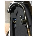 Pull down kitchen faucet . Scratched.