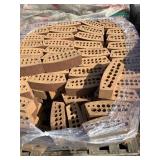 Round face red bricks sold by the pallet