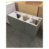 Grey modern bathroom vanity. No top.