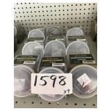 Assorted little jugs of drill bit inserts x9