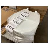 White plastic round bowl toilet seat