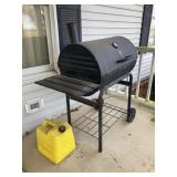 Charcoal Grill and Diesel Fuel Can