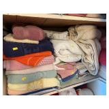 2nd shelf down of towels