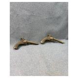 Two Antique Cast Metal Pet Toy Cap Pistols
