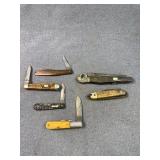 Six Folding Pocket Knives with Various Handles