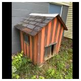 Wooden Dog House with Orange and Brown Stripes