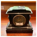 Antique Black Mantel Clock with Lion Head Accents