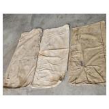 3 CLOTH FEED SACKS--SOME HAVE BEEN PATCHED