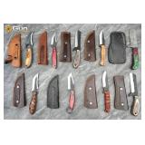 Nine fixed blade Damascus knives. Very Good Condit
