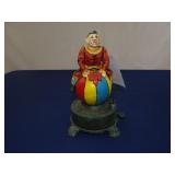 CAST IRON DANCING CLOWN COIN BANK