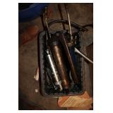 TOTE OF GREASE GUNS