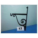 CAST IRON HANGER-16IN HIGH, 11IN TO WALL. CAST IRON HANGER-16IN HIGH, 11IN TO WALL.