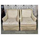 Two Well Worn Cream Colored Club Chairs