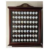 Golf Ball Collection In Glass Door Tee Box