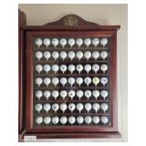 Golf Ball Collection In Glass Door Tee Box