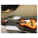 Guitar w/ a Case, 34"L, 12"W
