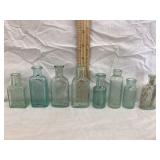 (8) Vintage Embossed Bottles