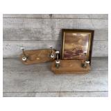 Coat hangers and framed picture