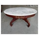 Victorian Revival style coffee table features a