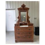 American walnut dresser features a swivel mirror
