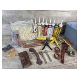 Caulking gun, caulk, pipe wrench