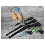 Toy guns, rubber chickens