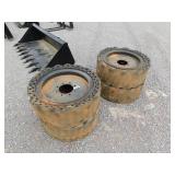 (4) SOLID SKID STEER TIRES MOUNTED