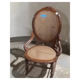 VintageCane Rocking Chair w/ Carved Back