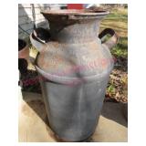 Old milk can - no lid (patio) good plant stand