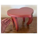 Small reddish wooden stool (heart shape)
