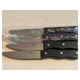 (K) 4 Oster Steak Knives w/ Black Handles